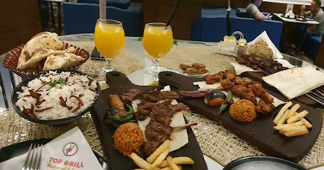 مطعم و لاونج توب قريل قمة المشويات - Top Grill Restaurant & Lounge - Tabuk - +966 53 322 7383